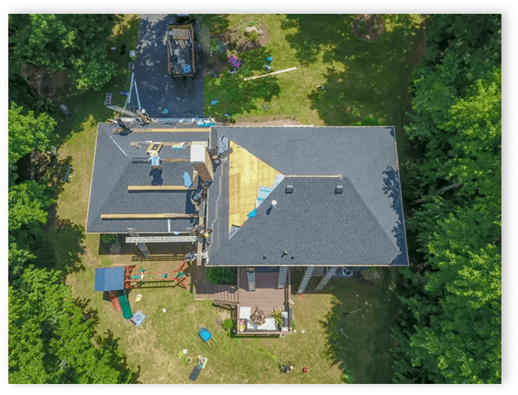 Aerial view of a roof being installed on a house